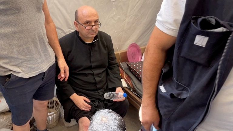 Father Gabriele Romanelli was injured in the strike. Pic: Reuters