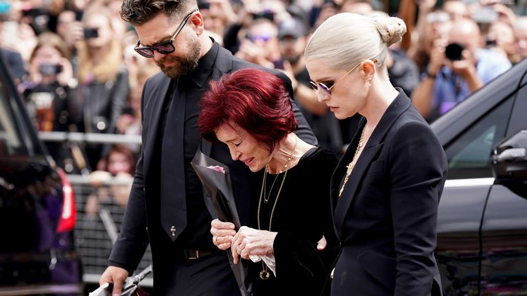 The family of Ozzy Osbourne (left to right) Jack Osbourne, Sharon Osbourne and Kelly Osbourne lay flowers.
Pic PA