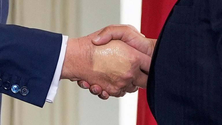 FILE - President Donald Trump, left, greets Bahrain's Crown Prince Salman bin Hamad Al Khalifa at the White House, July 16, 2025, in Washington. (AP Photo/Alex Brandon, File)