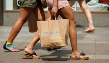 Shopper with Primark bag on Oxford Street, London during warm summer weather. Pic: PA