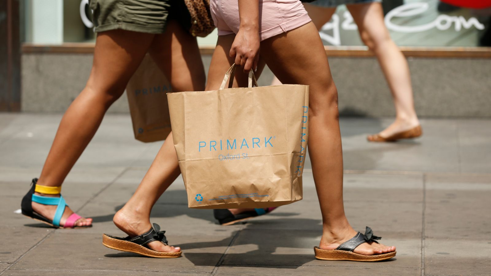Shopper with Primark bag on Oxford Street, London during warm summer weather. Pic: PA