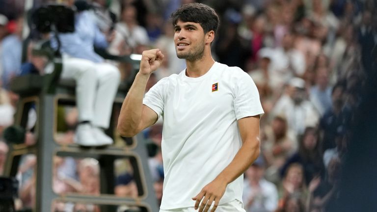 Spain's Carlos Alcaraz celebrates after beating Russia's Andrey Rublev during a fourth round men's singles match at the Wimbledon Tennis Cha