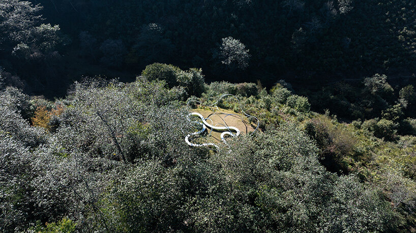 slender steel arcs blossom into kong xiangwei studio's camellia-like theater in china