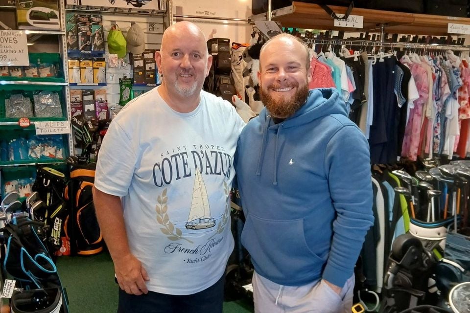 Ballyreagh assistant professional Gary McCloskey with golf star Tyrrell Hatton during his visit to the course