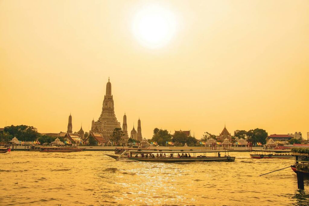 bangkok thailand in hazy sunshine from river where you can fly to direct from manchester