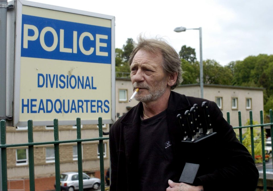 Man with knives outside police headquarters.