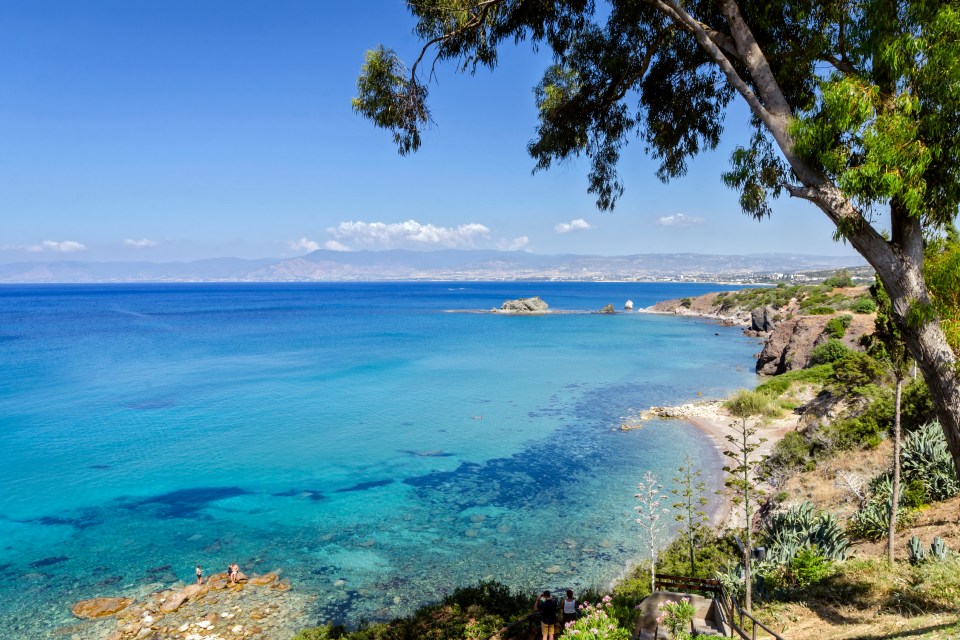 Coastal vista of the Baths of Aphrodite Beach in Cyprus.