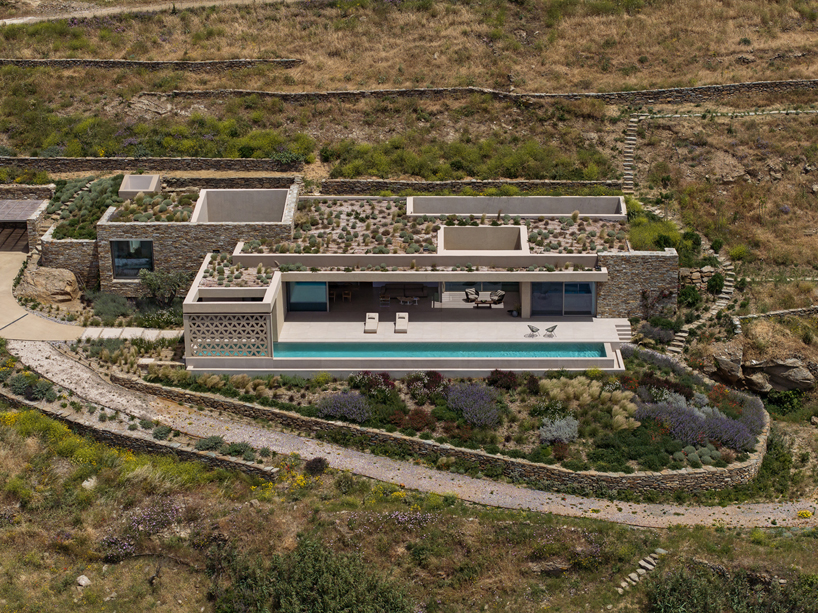 katerina valsamaki embeds subterranean house into hillside slot on tinos island, greece