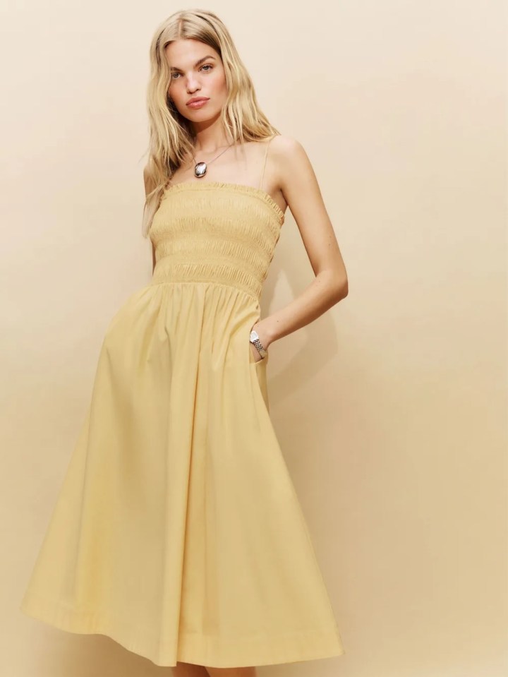 Woman in butter-yellow Reformation dress.