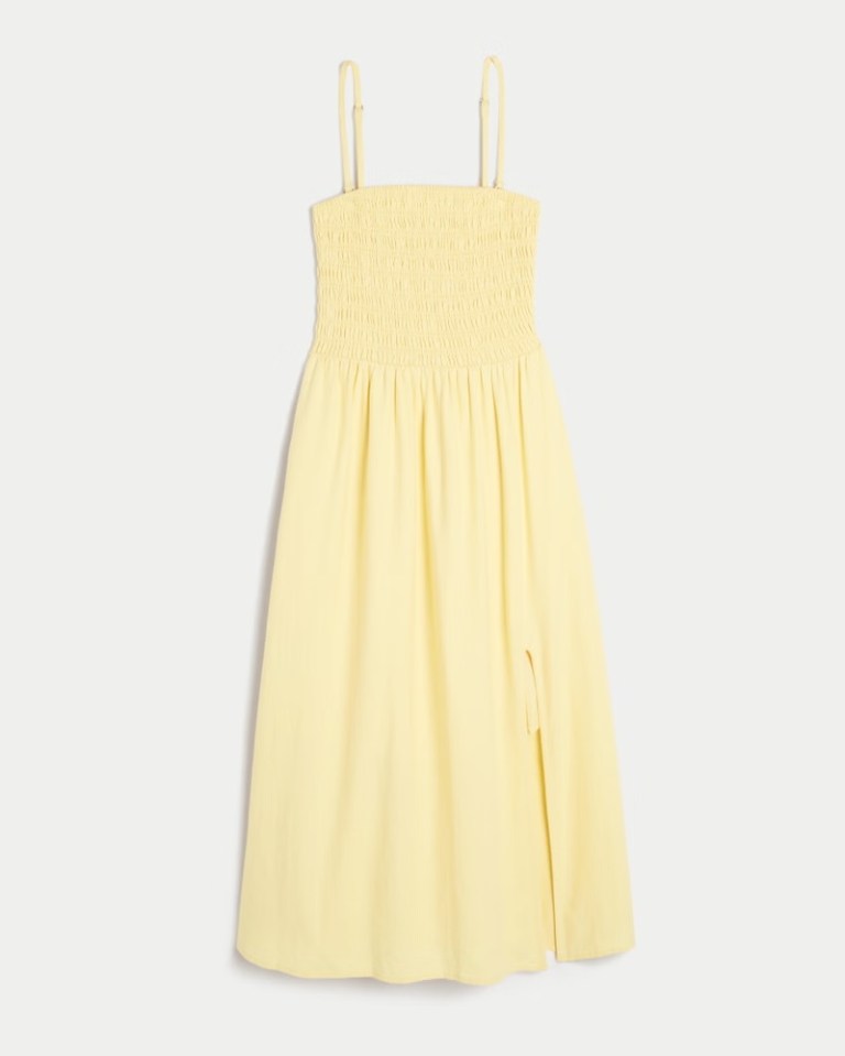 Pale yellow linen-blend midi dress with a smocked bodice and side slit.