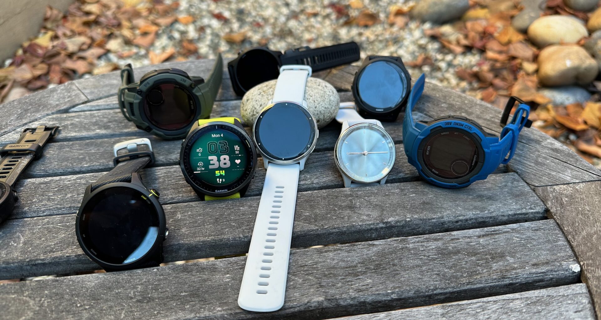 A collection of the best Garmin watches owned by the author: The Venu 3, Forerunner 965, 955, 265, and 255 Music, Instinct 2 Solar and 2X Solar, and Vivomove Trend.