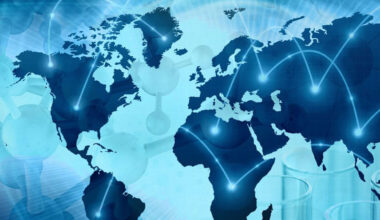 A stylized map of the world overlaid with glowing connection lines and molecular structures, representing global collaboration in biological security and scientific surveillance. The image includes faint outlines of laboratory equipment, emphasizing the role of science and technology in health security.