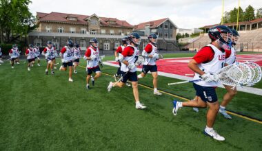 USA U20 lacrosse players run onto the field at a training camp at Cornell University
