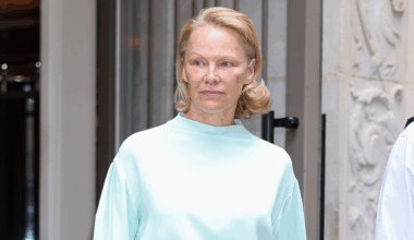 Pamela Anderson paired a monochromatic skirt set with Strathberry's Mosaic Bag.