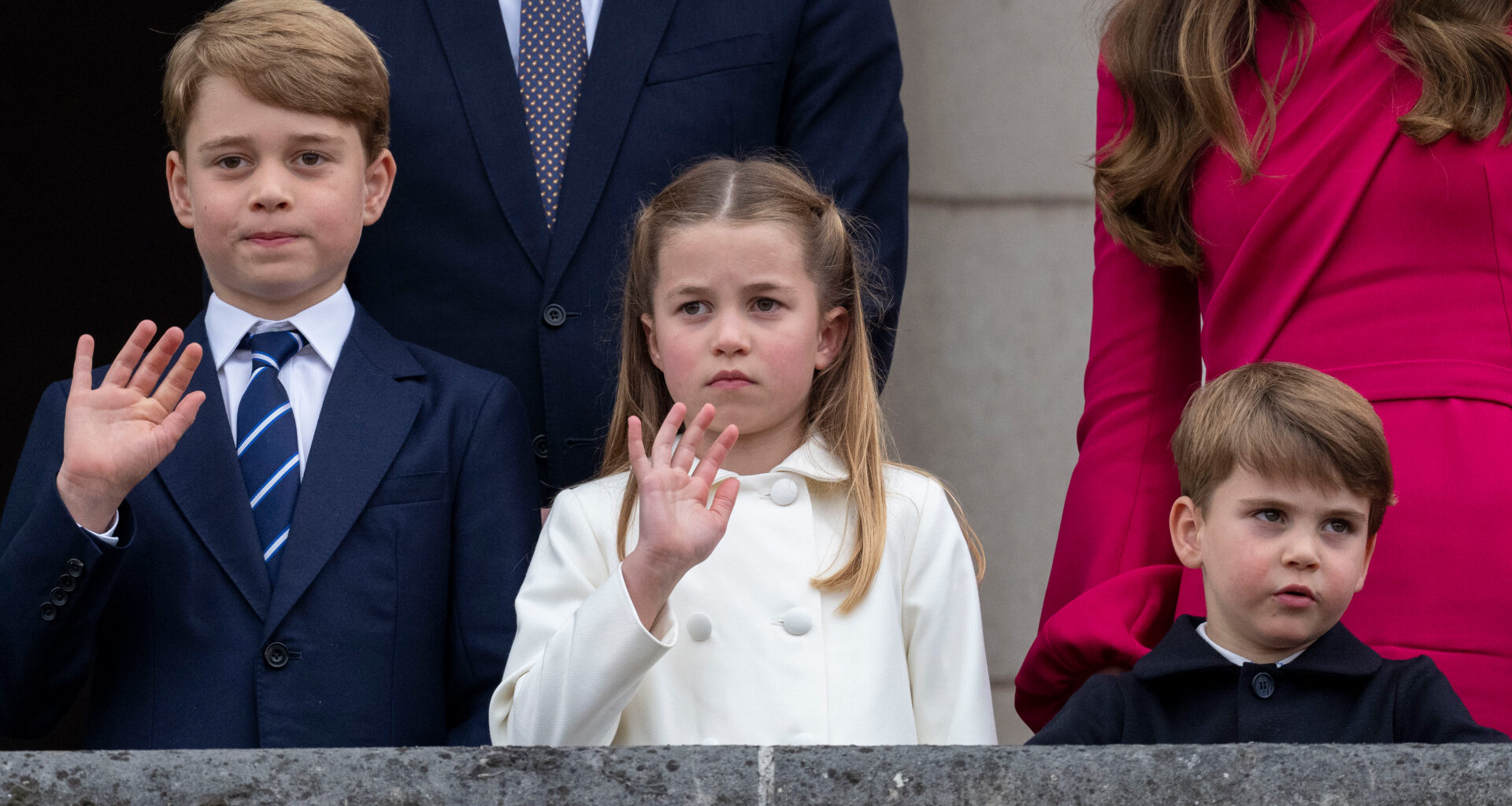 Prince George wears a navy suit with a striped tie, Princess Charlotte wears a white coat, and Prince Louis looks bored