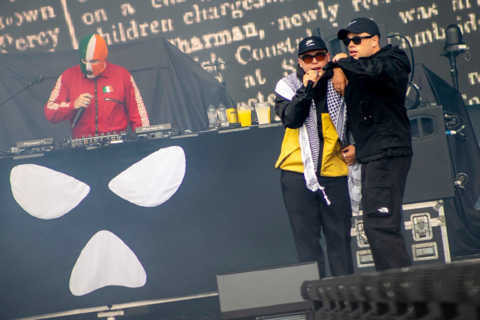 Three musicians performing on stage.
