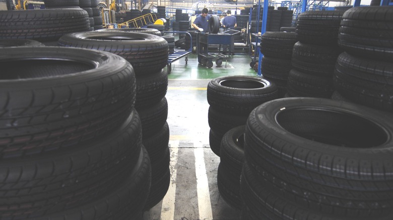 Stacks of finished tires on the floor of a factory
