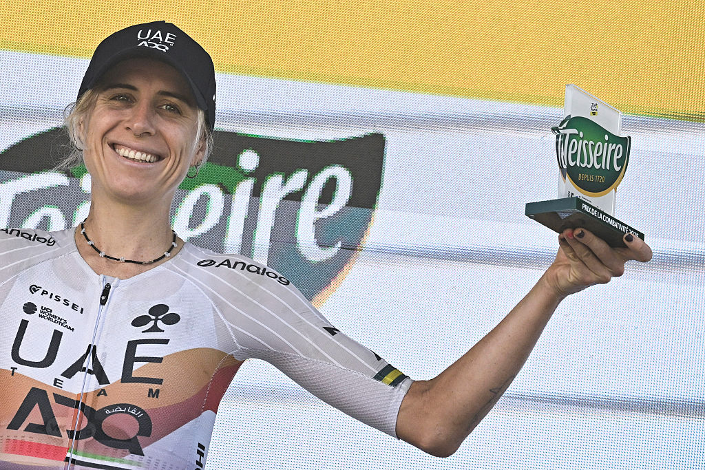 UAE Team ADQ's Australian rider Brodie Chapman celebrates on the podium with the most combative rider's award after the 5th stage (out of 9) of the fourth edition of the Women's Tour de France cycling race, 165.8 km from Chasseneuil-du-Poitou to Gueret, in Gueret, central France on July 30, 2025. (Photo by JULIEN DE ROSA / AFP)