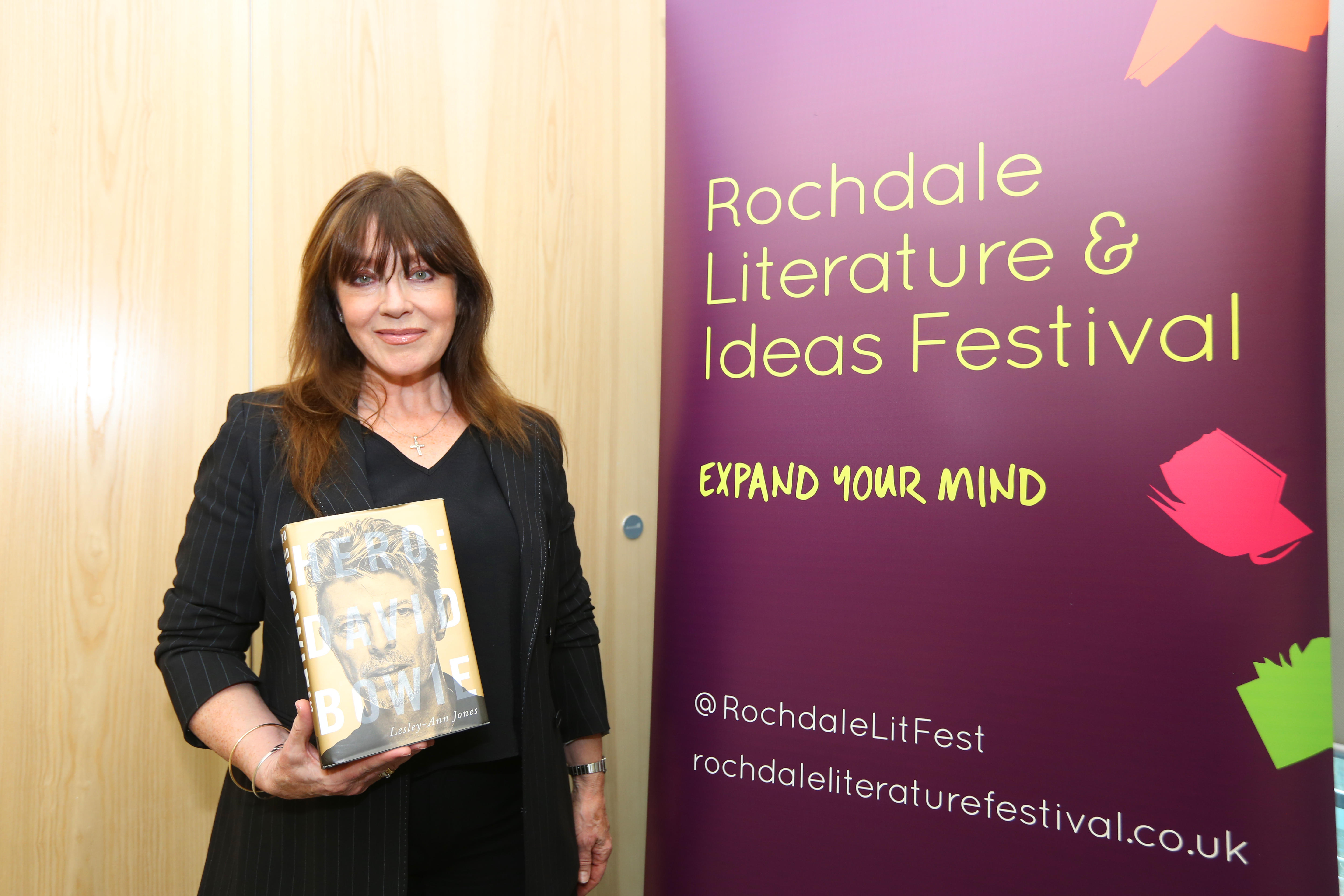 Lesley-Ann Jones holding her book about David Bowie at the Rochdale Literature & Ideas Festival.