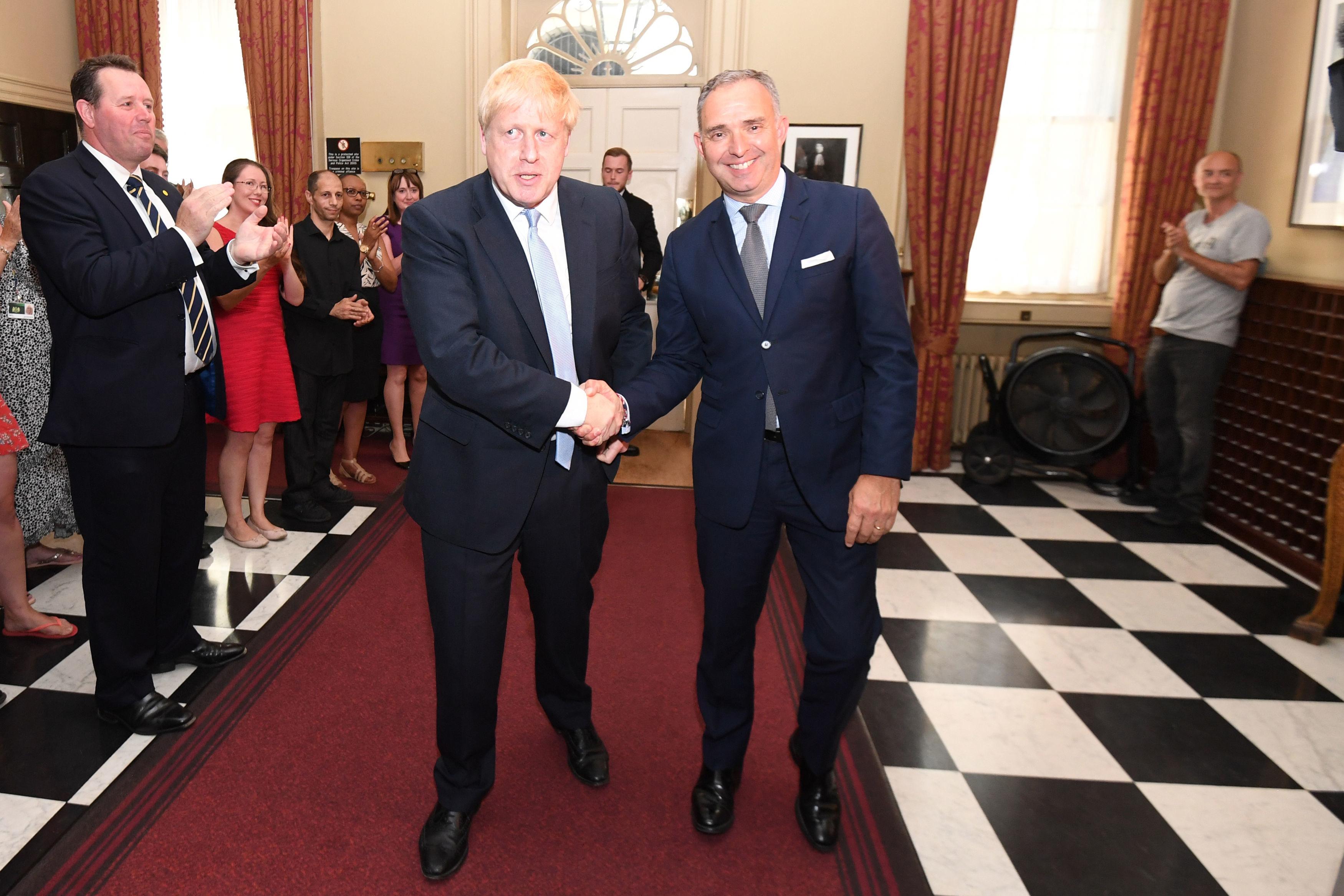 Boris Johnson shaking hands with Sir Mark Sedwill at 10 Downing Street.