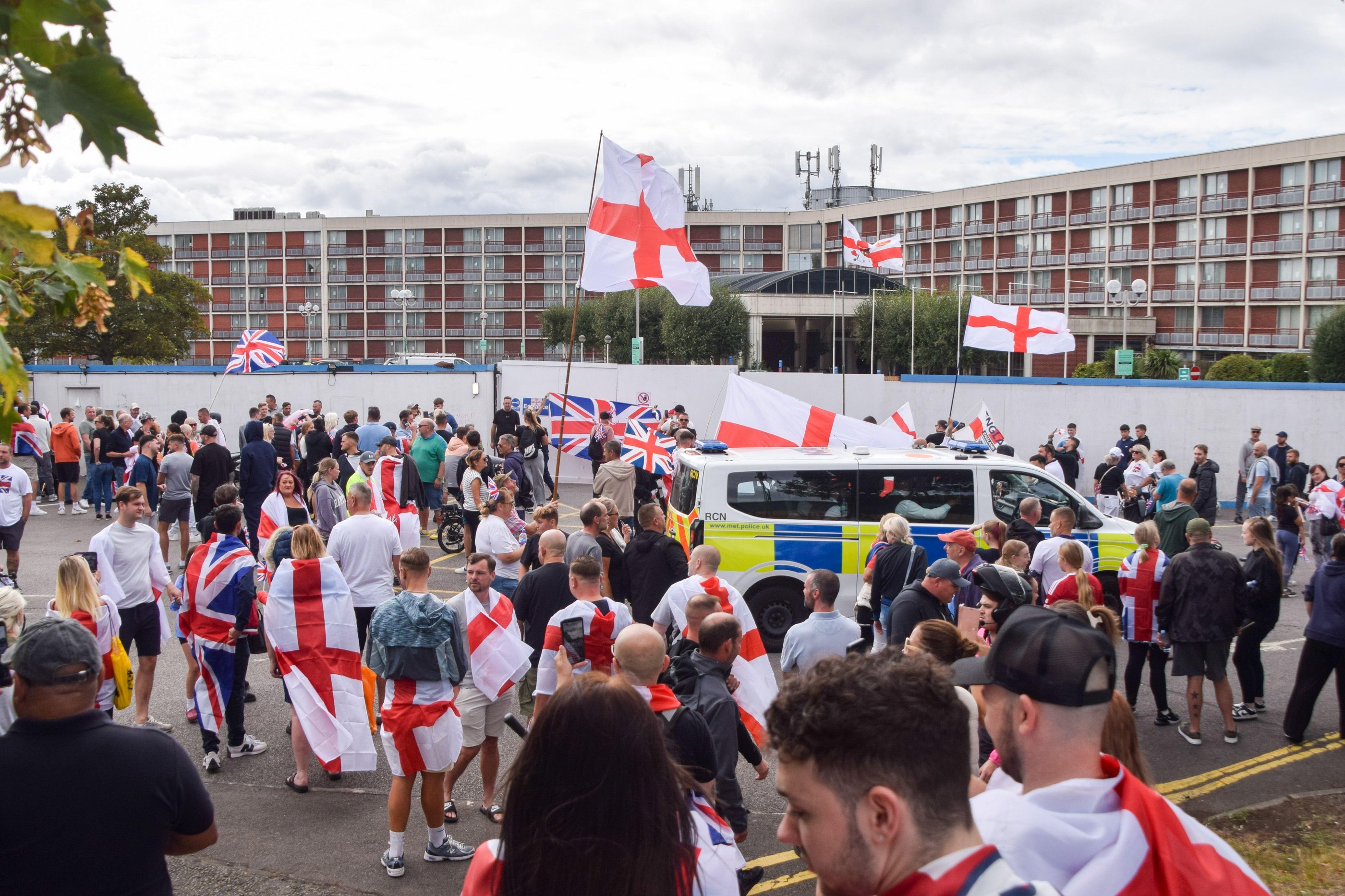 Anti-migrant demonstrators protesting outside a hotel in West Drayton, London.