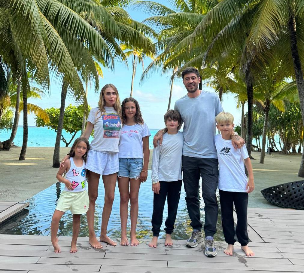 Family posing on a deck in Bora Bora.