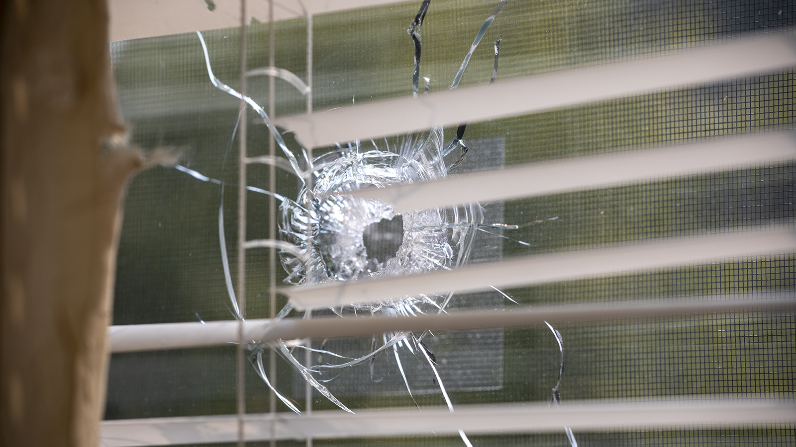 Bullet hole in a window.