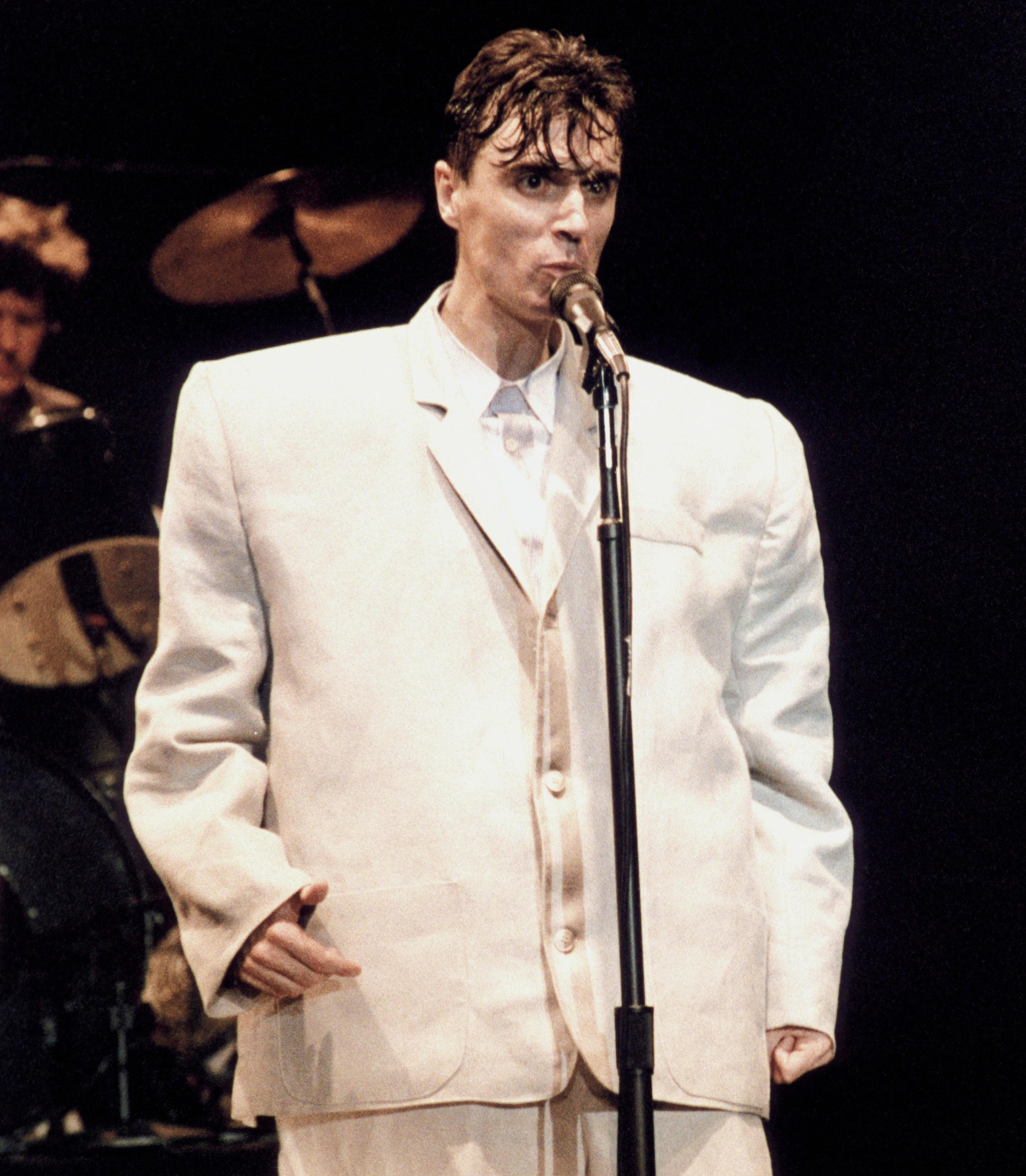 David Byrne of Talking Heads performing in an oversized suit.