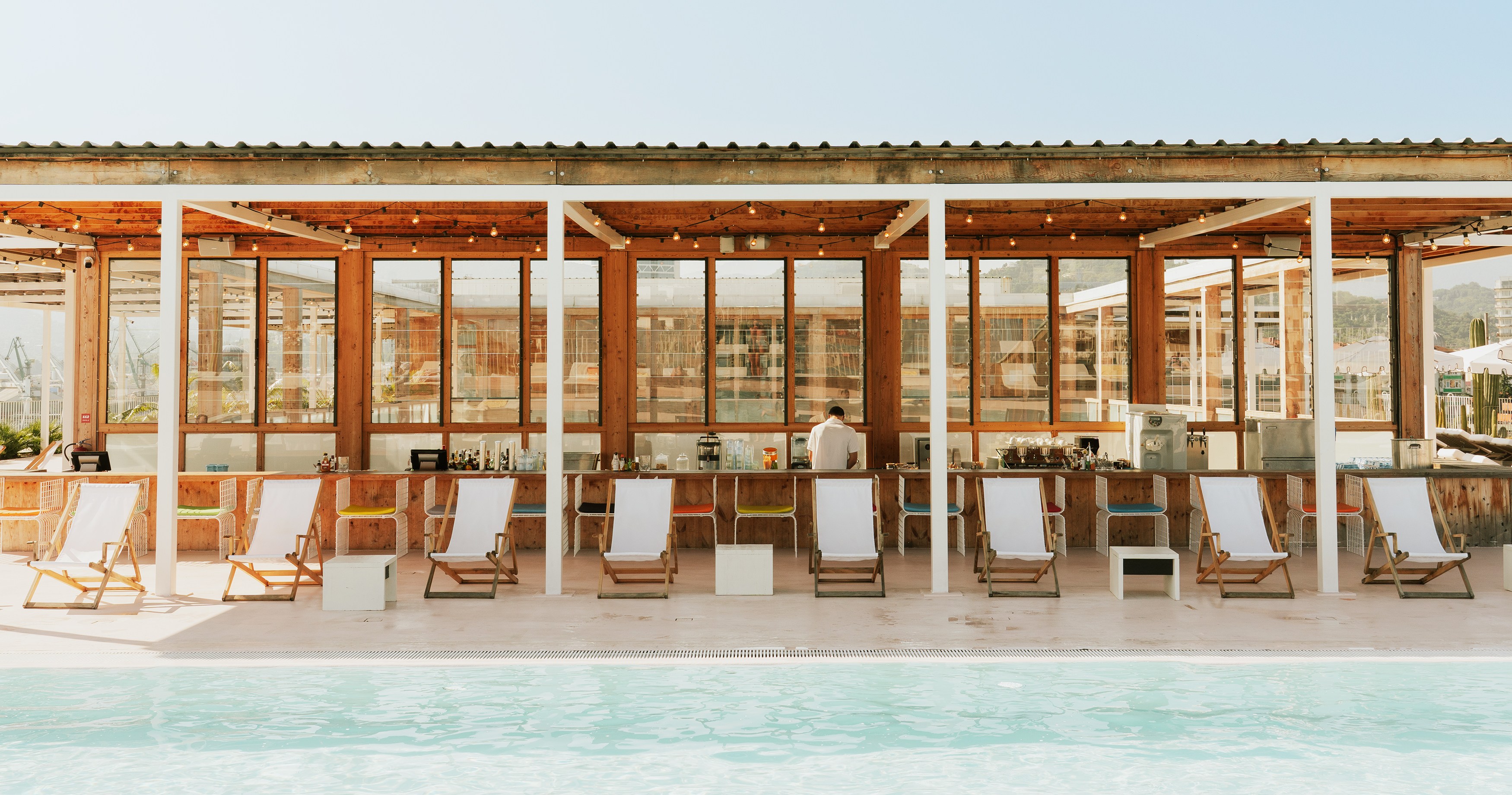 Poolside bar with deck chairs.