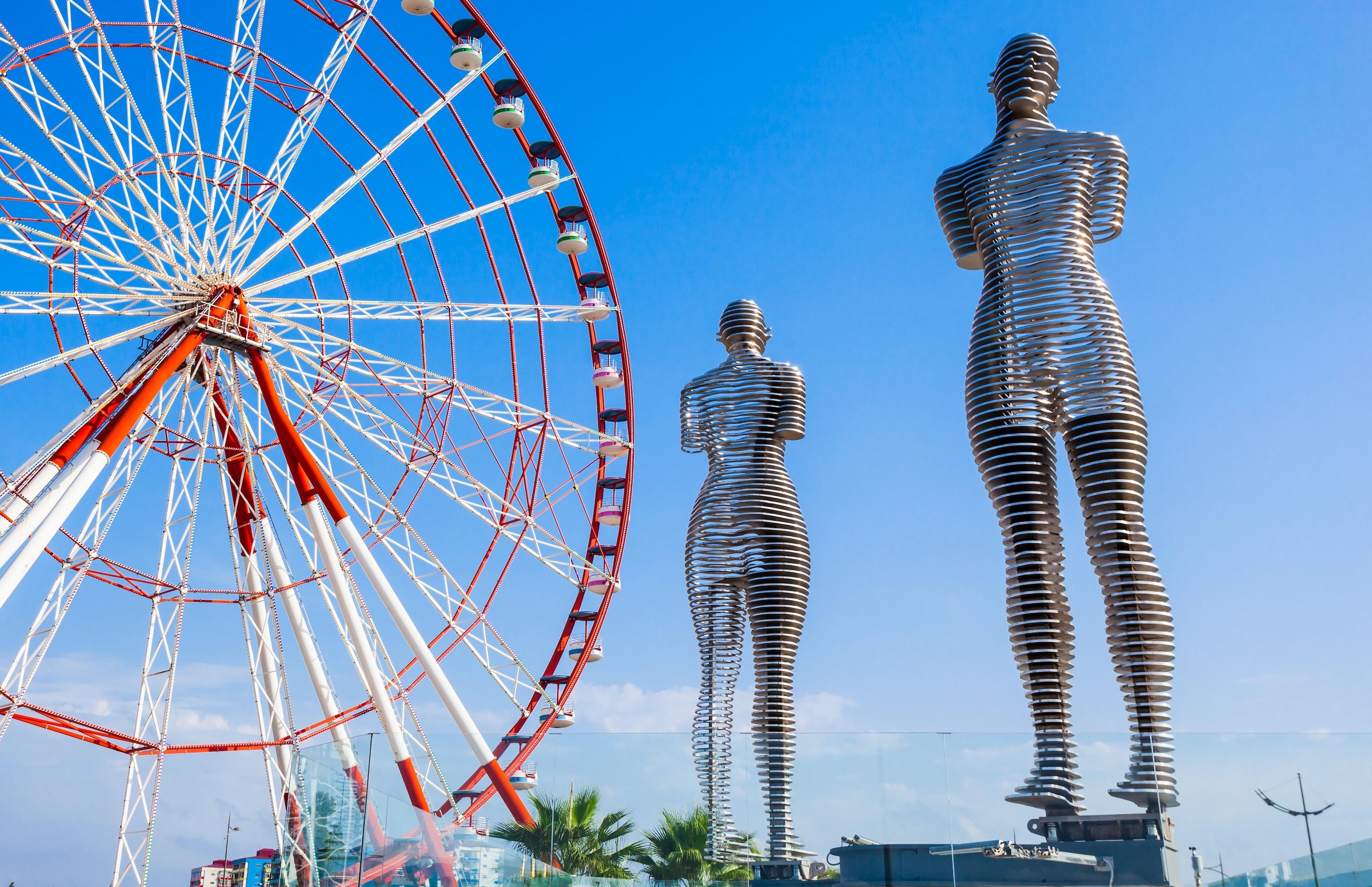 Ferris wheel and the Ali and Nino sculpture in Batumi, Georgia.