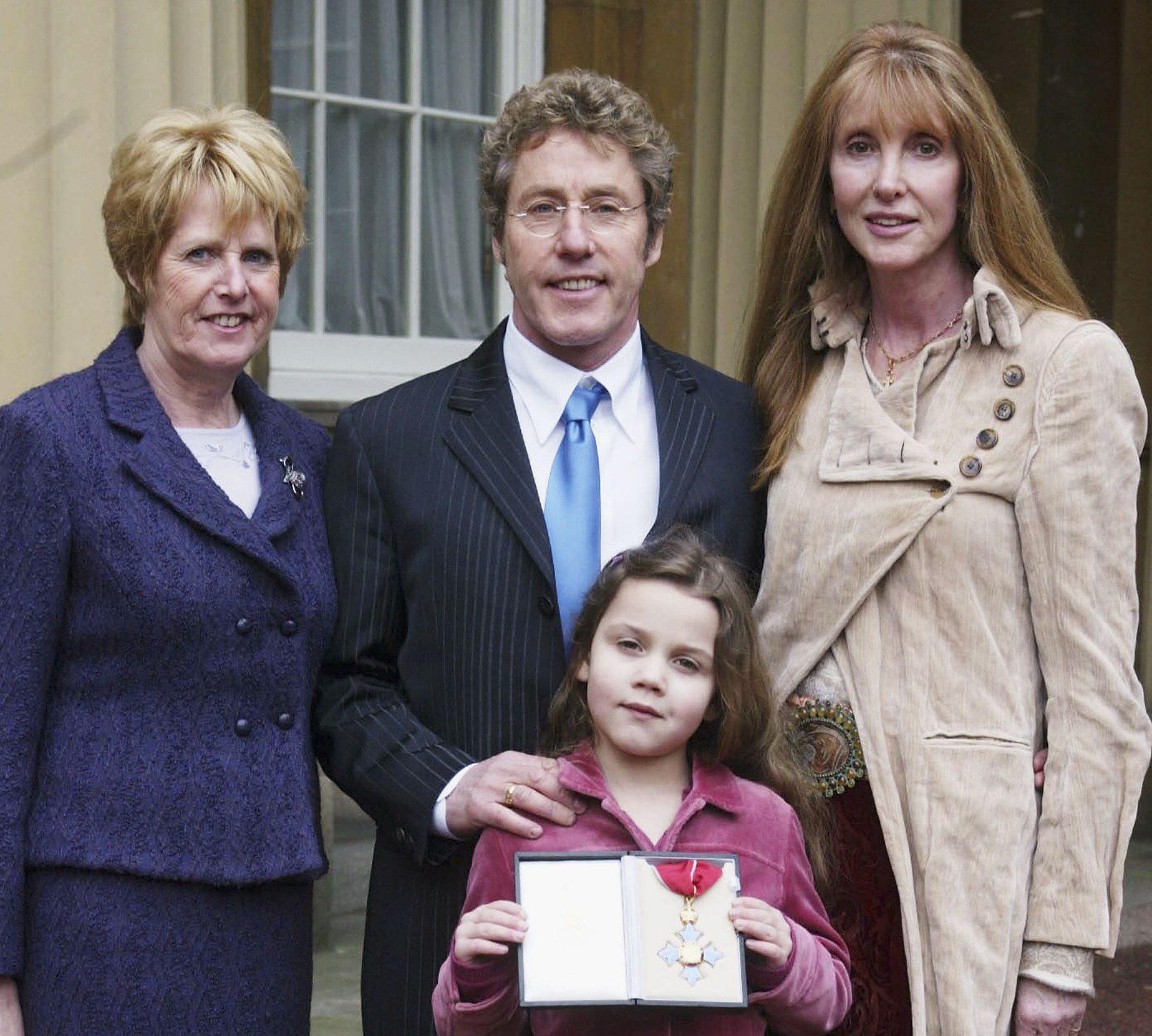 Roger Daltrey with his family at Buckingham Palace after receiving his CBE.