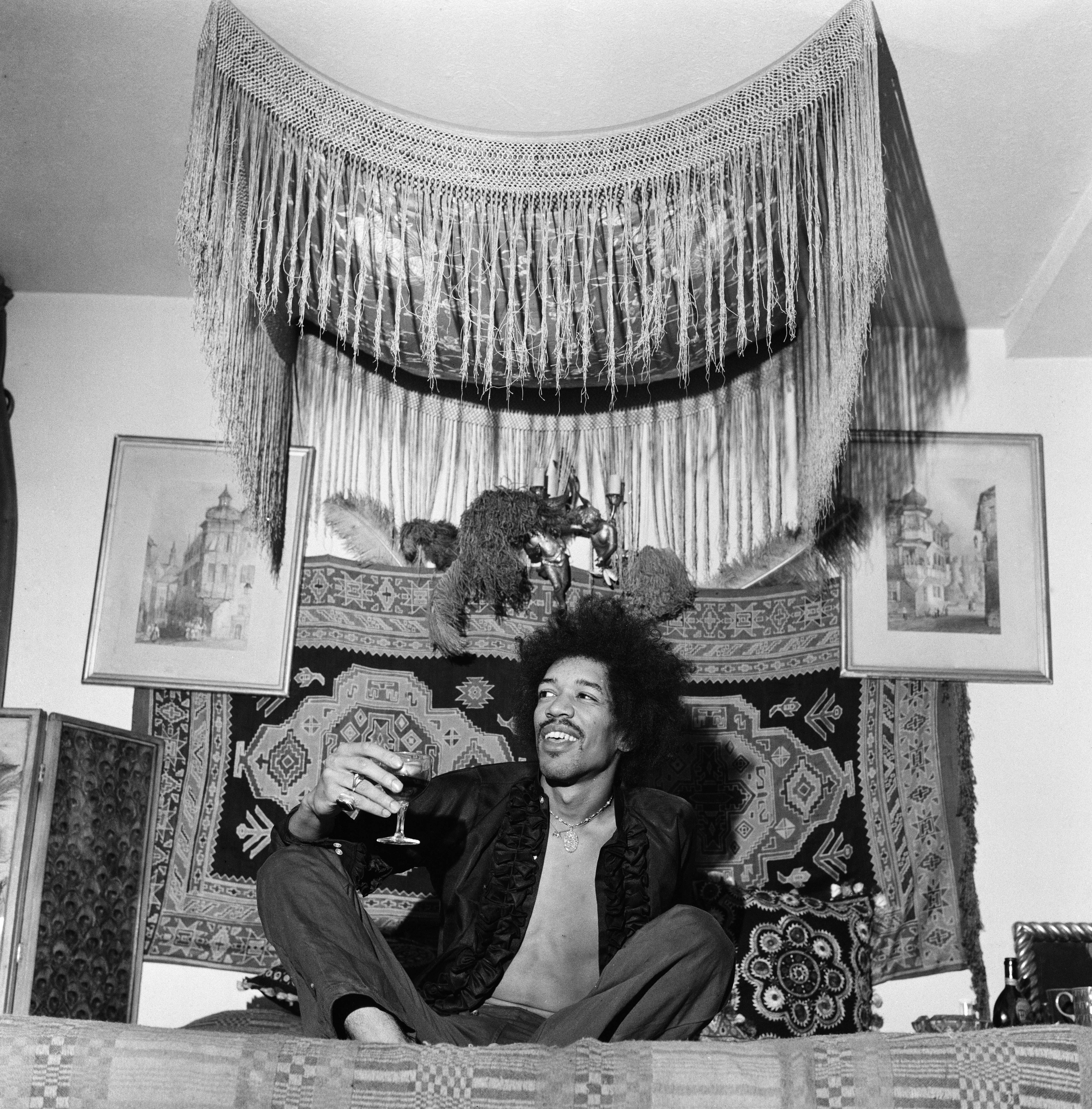 Black and white photo of Jimi Hendrix in his Mayfair flat.