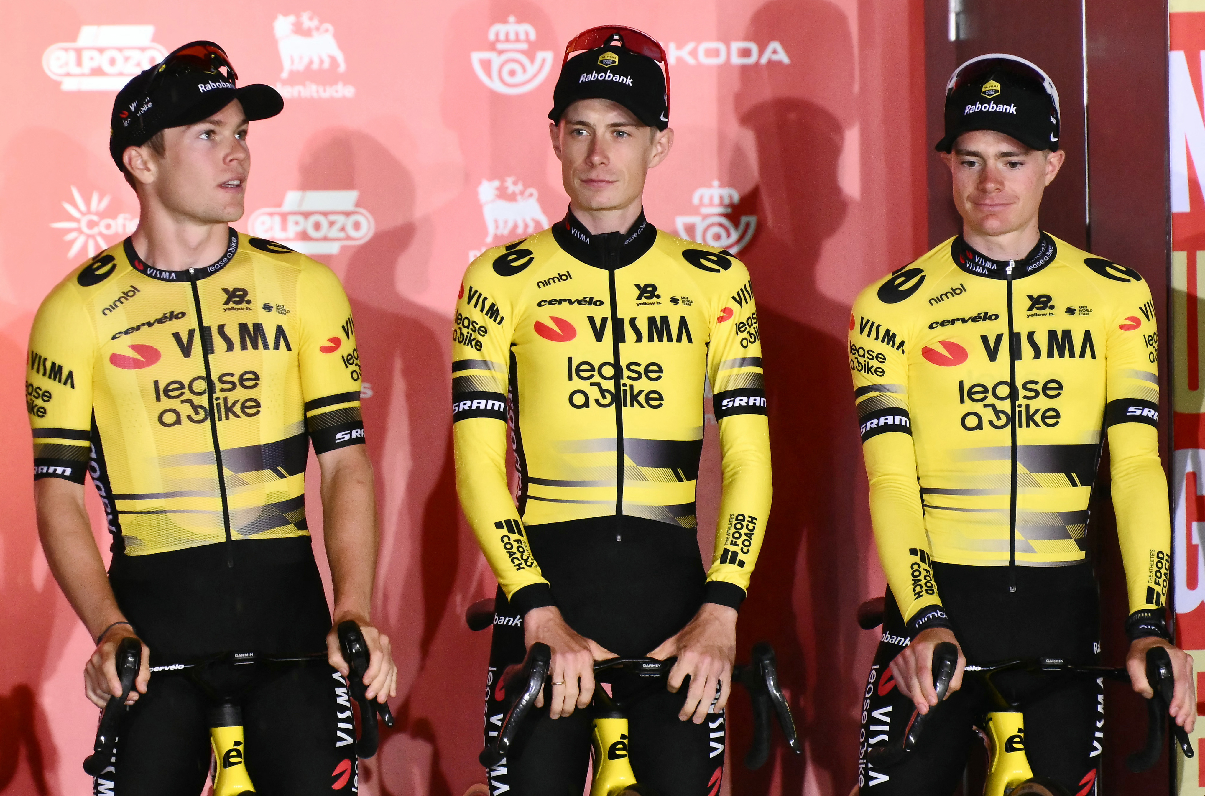 Jonas Vingegaard and two other Team Jumbo-Visma cyclists at the Vuelta a España team presentation.