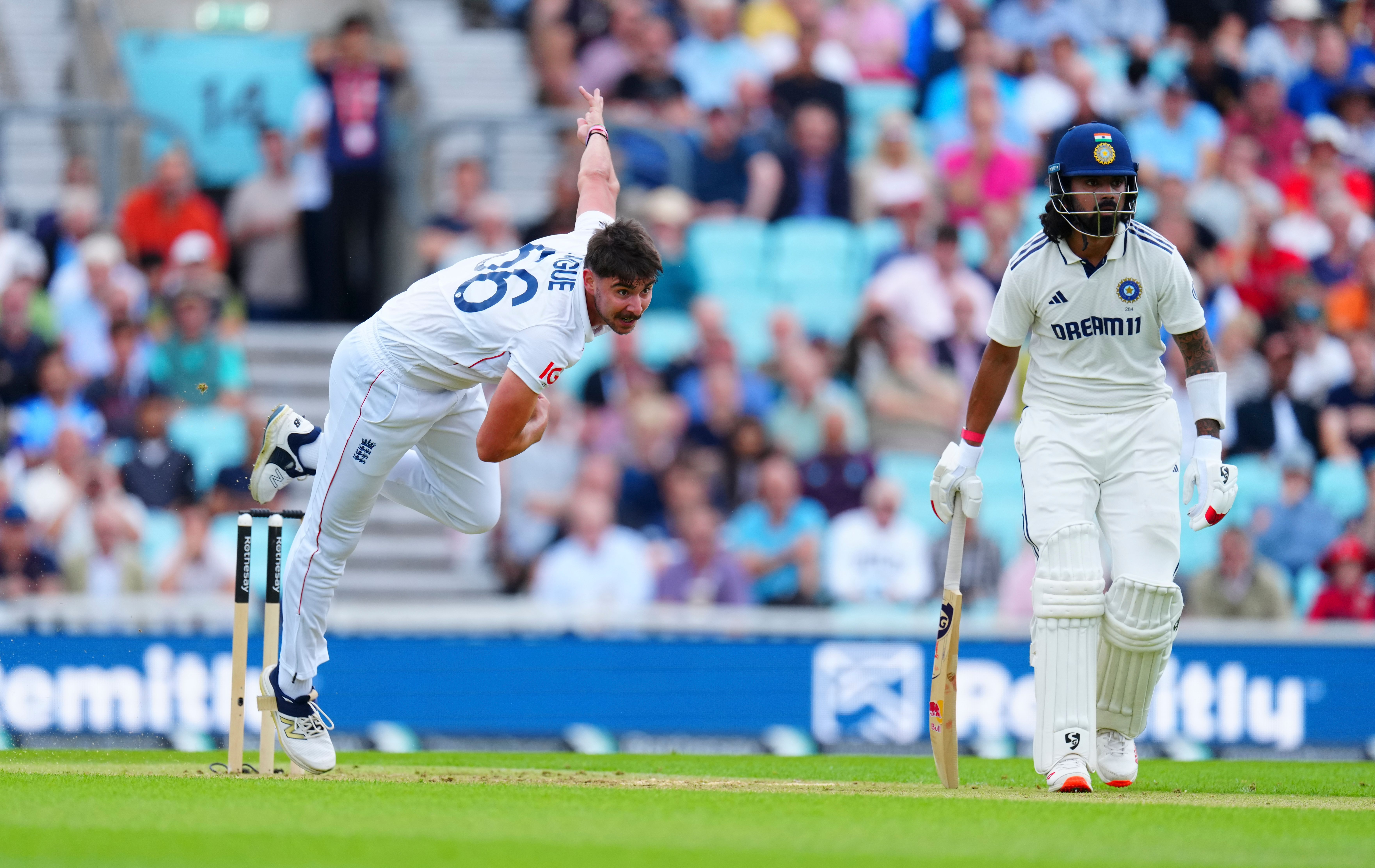 Josh Tongue bowling to an Indian batsman during a cricket match.