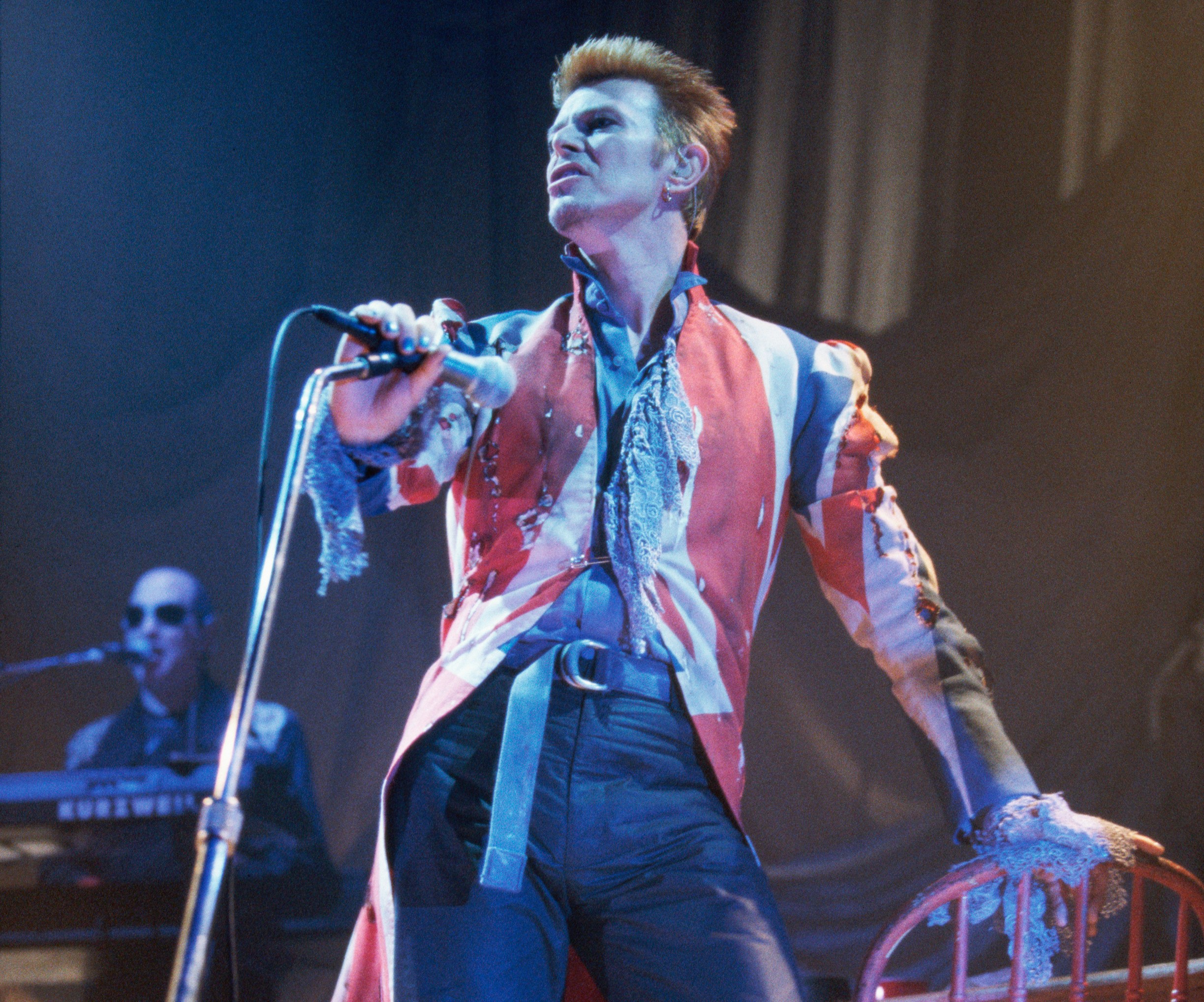 David Bowie performing on stage.