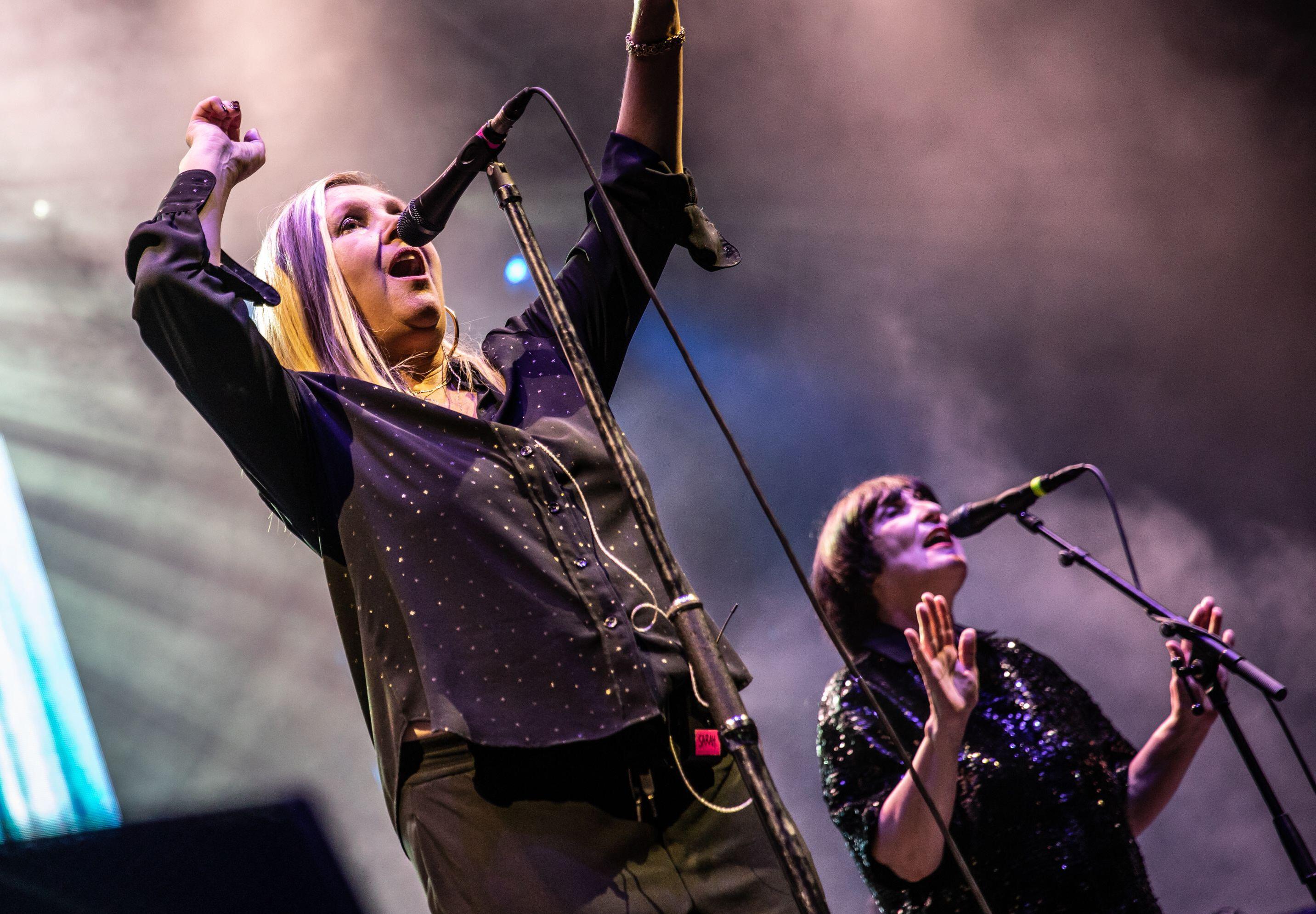 Saint Etienne performing live on stage.