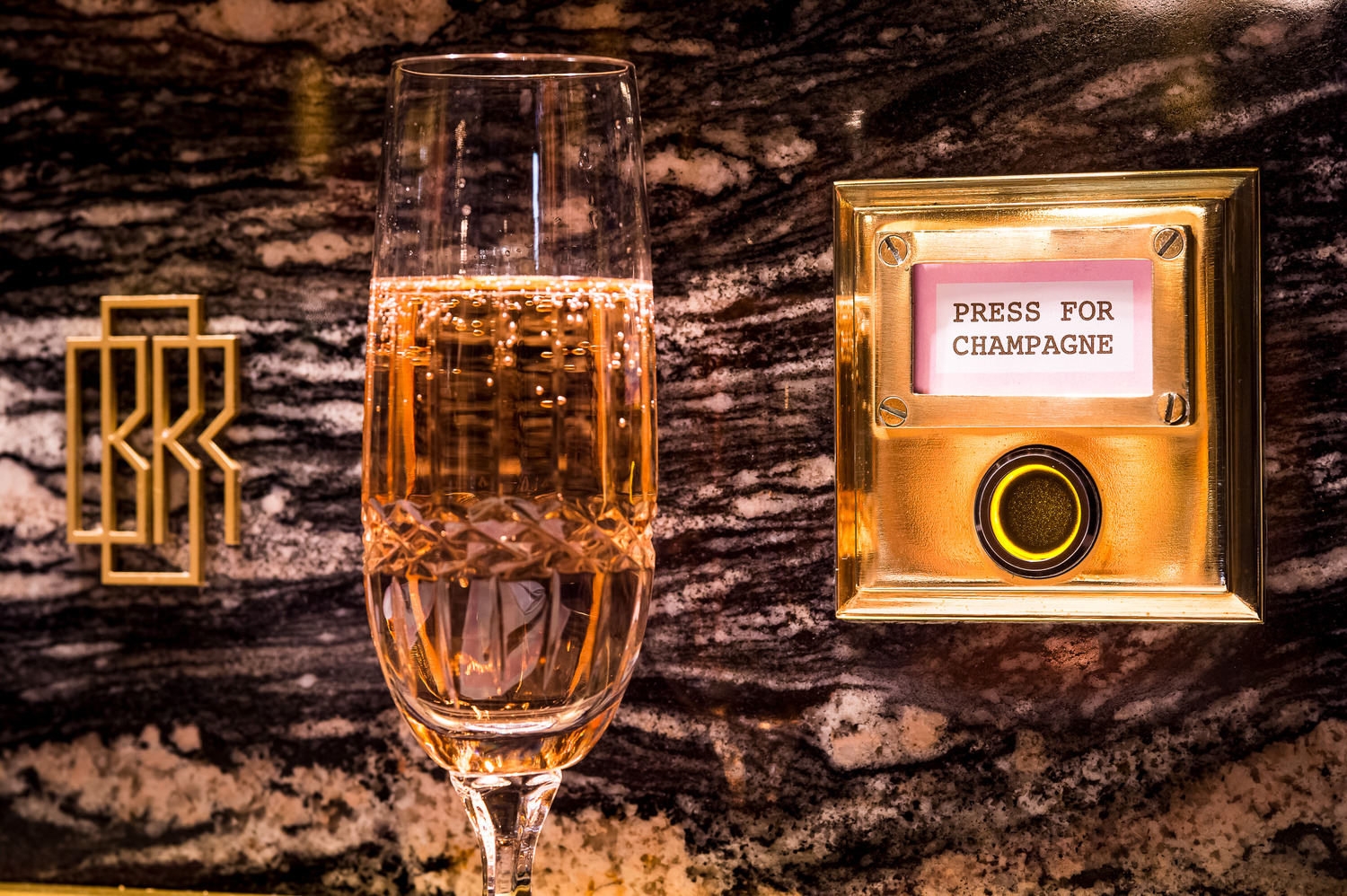 Champagne flute next to a button that says "Press for Champagne."