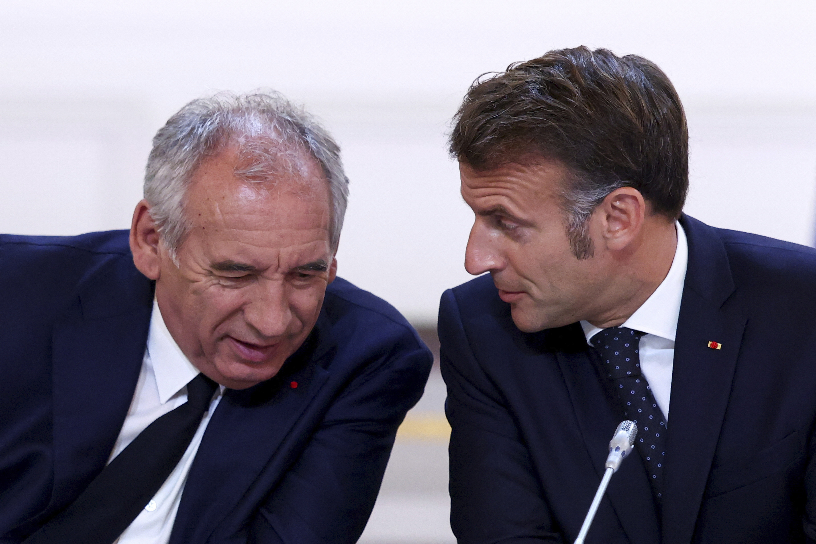 French President Emmanuel Macron and Prime Minister François Bayrou in discussion.