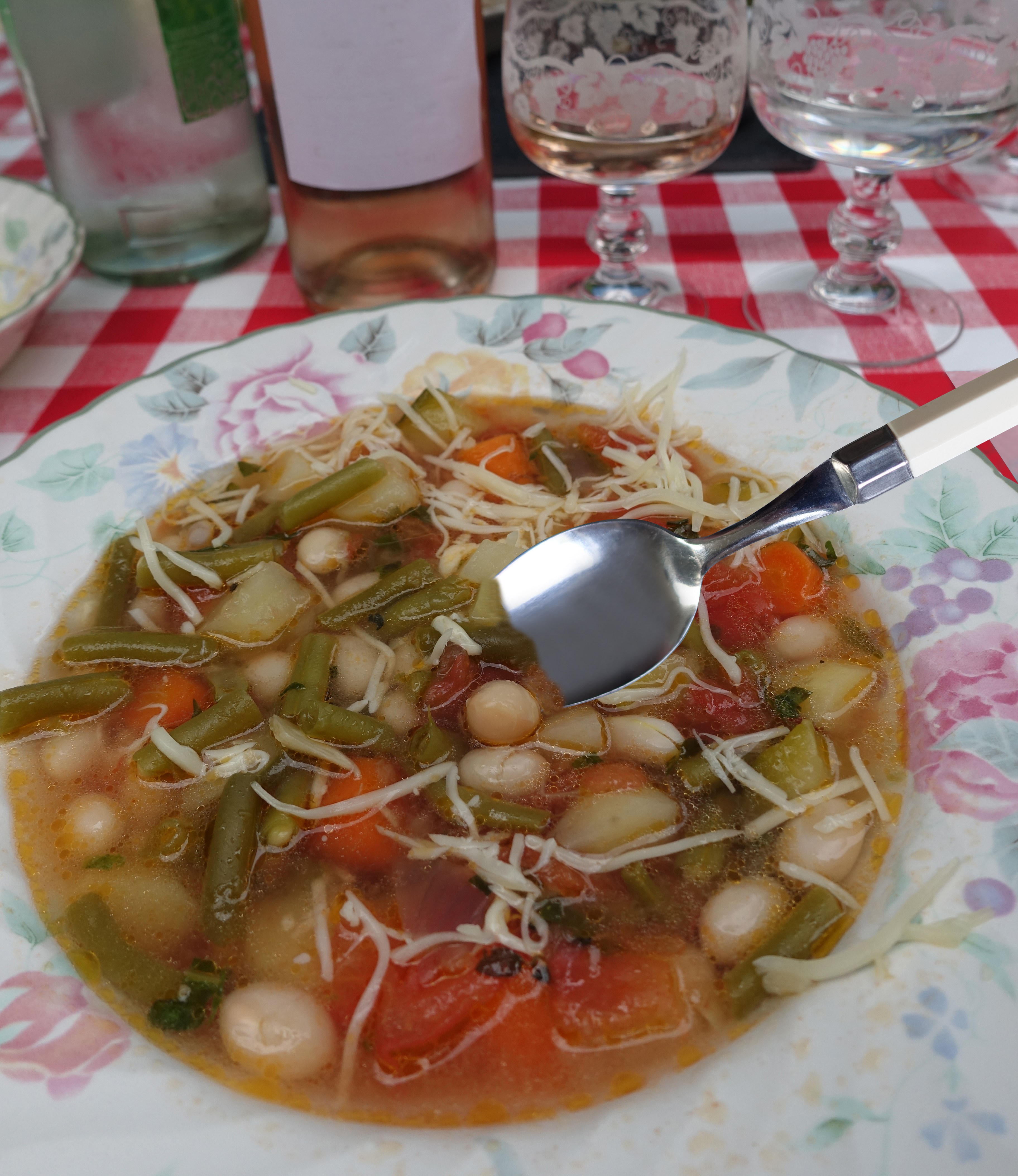 Pistou soup Meal served Wine and water bottles and glasses Rosé wine French cuisine