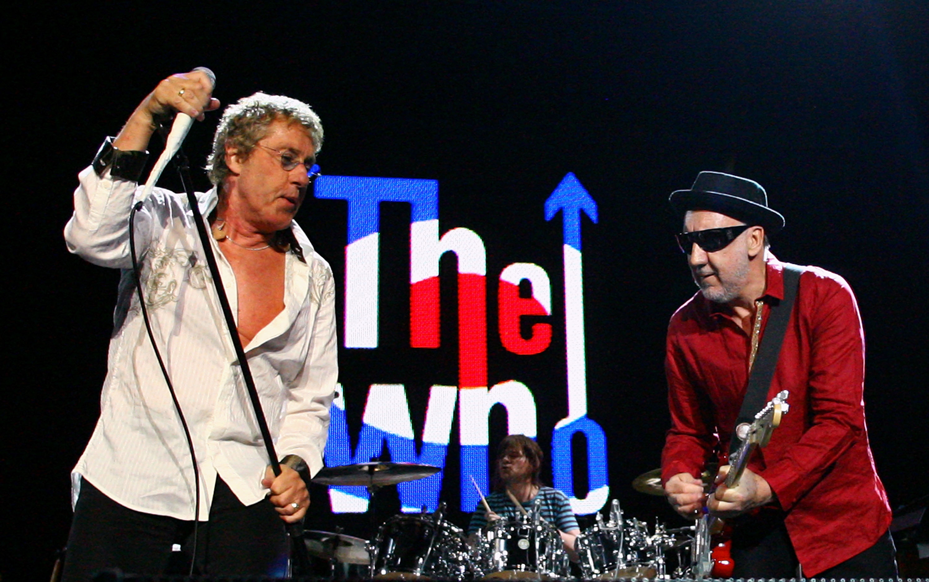 Roger Daltrey and Pete Townshend of The Who performing on stage.