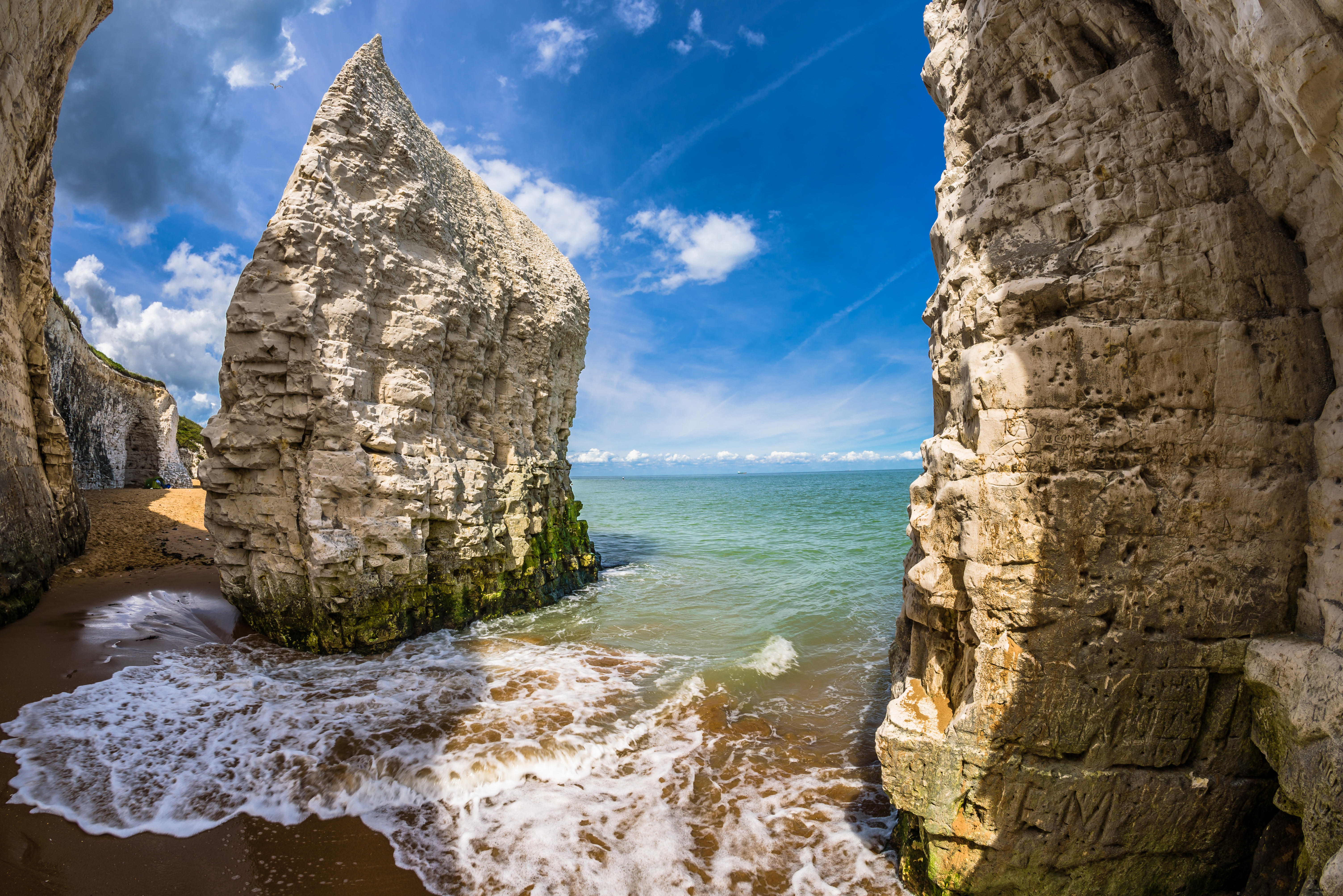 Botany Bay beach in Kent, England, with white cliffs and waves.
