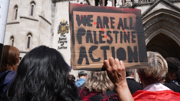Protesters outside the Royal Courts of Justice on The Strand, central London,