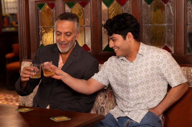Dev and Aadi cheersing in the Rovers in Corrie
