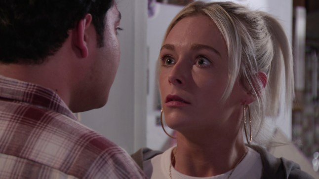 Lauren looking at Aadi in horror in Corrie