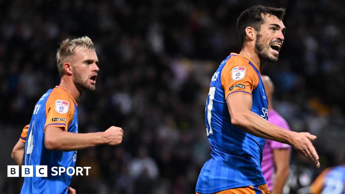 John Marquis (right) celebrates scoring for Shrewsbury