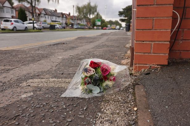 Flowers left at the scene on Warwick Road, Acocks Green, where a motorcyclist died