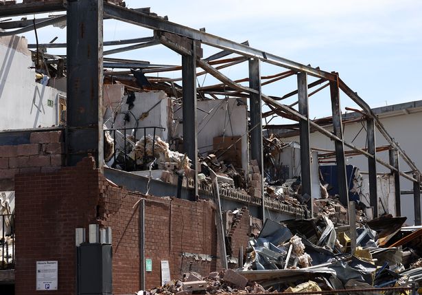 Street-level image of the damaged Storage World building in Middleton