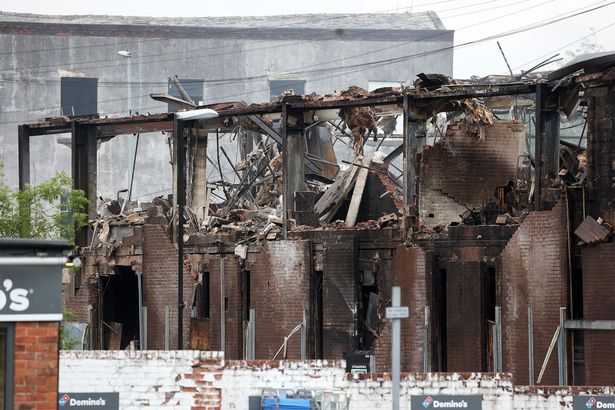 Street-level image of the damaged Storage World building in Middleton