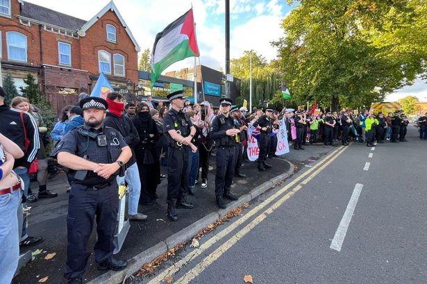 Protestors outside the Best Western hotel in Wilmslow Road, Fallowfield.