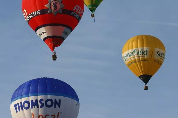 Balloons in an early morning flight at the Bristol Balloon Fiesta